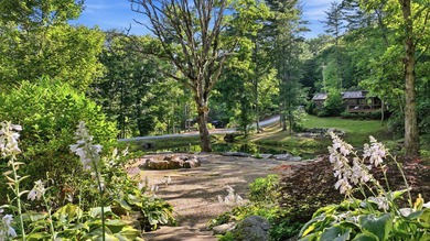 Perched on 1.12 private acres, this custom-built Timbercraft - photo 33