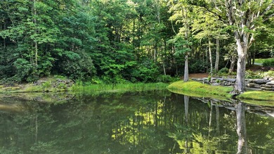Perched on 1.12 private acres, this custom-built Timbercraft - photo 35