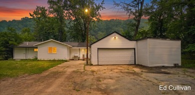 Enjoy the best of Muskegon River living with this updated - photo 1