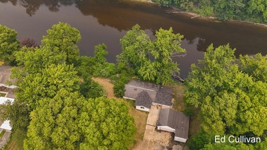 Enjoy the best of Muskegon River living with this updated - photo 3
