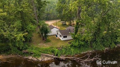 Enjoy the best of Muskegon River living with this updated - photo 5
