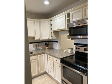 WELCOME TO THIS BEAUTIFULLY UPDATED 2 BEDROOM, 2 BATH VILLA IN - photo 3