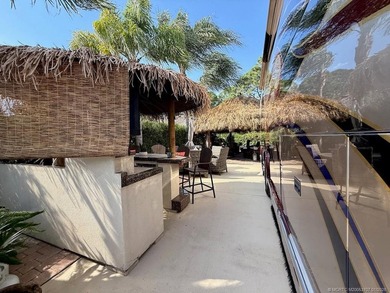 YOUR TROPICAL OASIS AWAITS! Ideally situated near the north - photo 17
