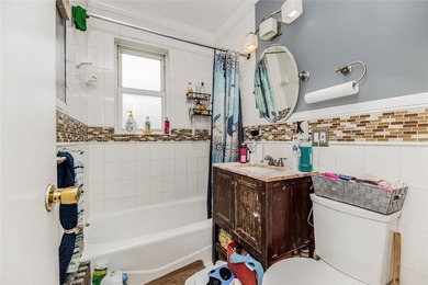 Welcome to 4101 Paulding Avenue, a charming brick single-family - photo 13