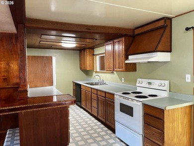 This charming 2-bedroom, 1-bath manufactured home sits on a - photo 13