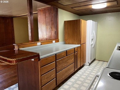 This charming 2-bedroom, 1-bath manufactured home sits on a - photo 16