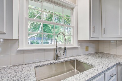 Welcome to this charming 3-bedroom brick ranch nestled on a - photo 19