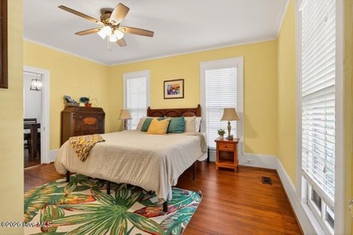 Step into the charm and character of downtown living in this - photo 11