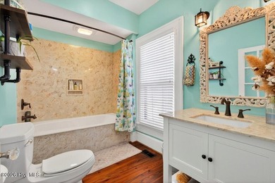 Step into the charm and character of downtown living in this - photo 12