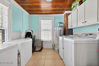 Step into the charm and character of downtown living in this - photo 13