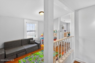 Step into the charm and character of downtown living in this - photo 14