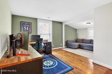 Step into the charm and character of downtown living in this - photo 15