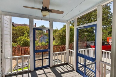Step into the charm and character of downtown living in this - photo 21