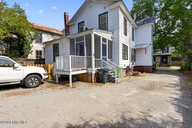 Step into the charm and character of downtown living in this - photo 26