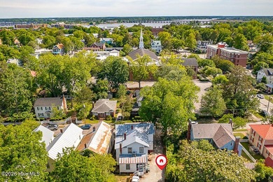 Step into the charm and character of downtown living in this - photo 27