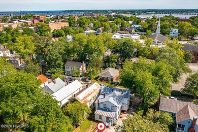 Step into the charm and character of downtown living in this - photo 29