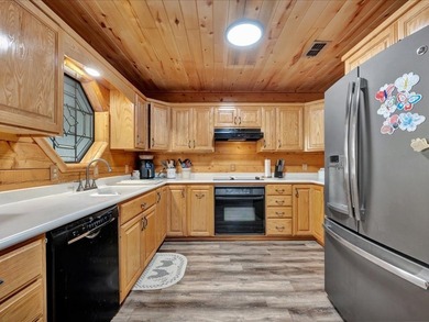 This lake property is special, featuring multiple living - photo 13