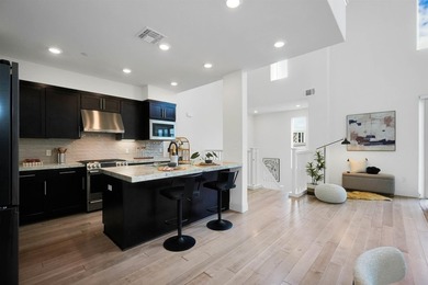 Built in 2021, this sophisticated townhouse-style condominium - photo 13