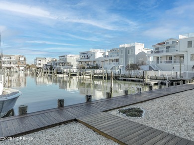 A rare 100ft dock lagoon-front offering in the heart of Beach