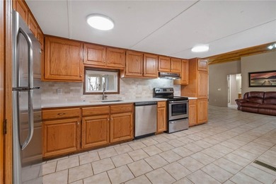Enjoy seasonal lake views of Beaver Lake from this inviting - photo 9