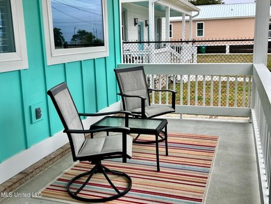Wake up to coastal breezes and water views in this beautiful - photo 3