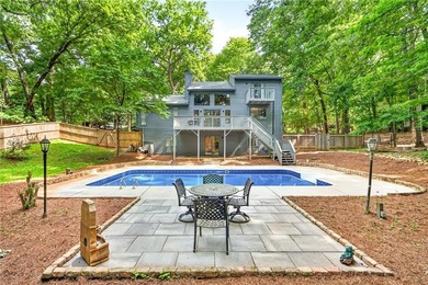 Tucked away on nearly an acre in the highly sought-after - photo 44