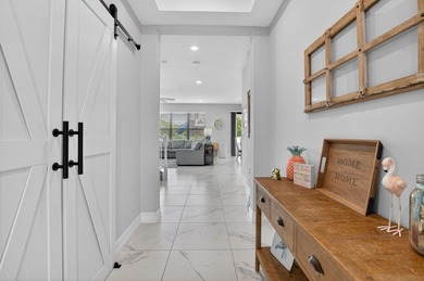 Discover waterfront living in Palm Meadows Estates. This - photo 5