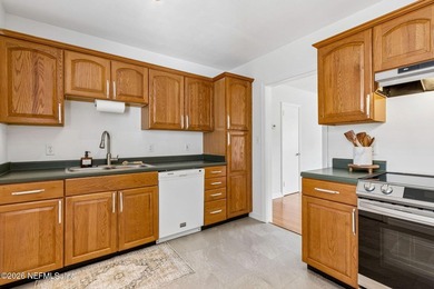 A charming red brick bungalow in the Murray Hill area that is - photo 3