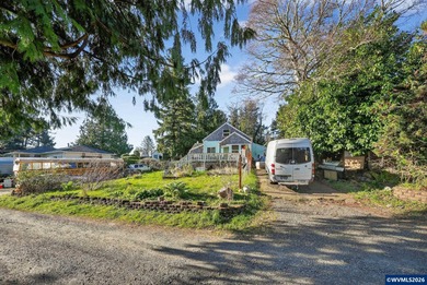 Coastal cottage full of character and opportunity. Wood siding