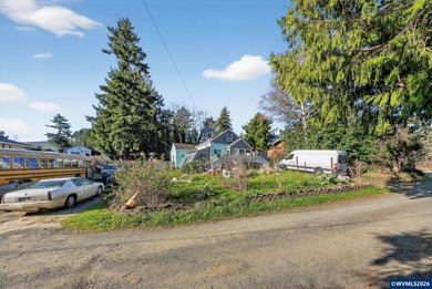 Coastal cottage full of character and opportunity. Wood siding