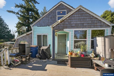Coastal cottage full of character and opportunity. Wood siding