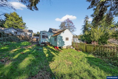 Coastal cottage full of character and opportunity. Wood siding