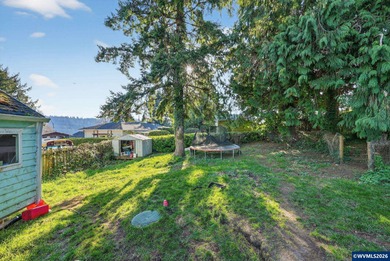 Coastal cottage full of character and opportunity. Wood siding