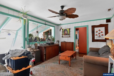 Coastal cottage full of character and opportunity. Wood siding