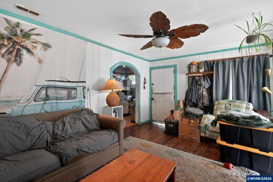 Coastal cottage full of character and opportunity. Wood siding