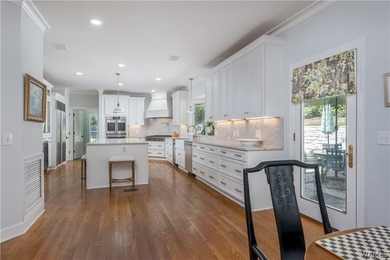 Nestled on a private 2.41-acre lot with an additional 1.51-acre