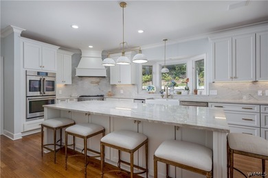 Nestled on a private 2.41-acre lot with an additional 1.51-acre