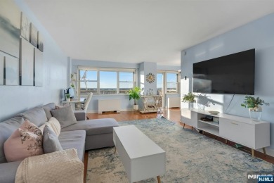 Live above it all in this 21st-floor corner residence with