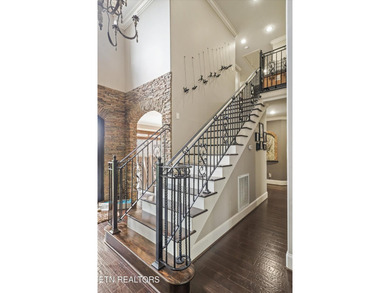 This property features an open floor plan with hardwood flooring - photo 8