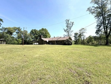 This house sets quietly on a hilltop with 19 acres surrounding - photo 2