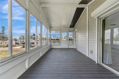 **SHORT SALE!** Light-filled corner home on the Caloosahatchee