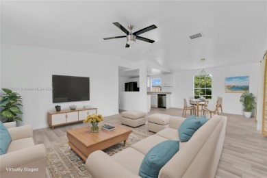 **SHORT SALE!** Light-filled corner home on the Caloosahatchee