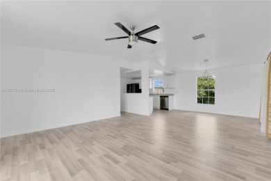 **SHORT SALE!** Light-filled corner home on the Caloosahatchee