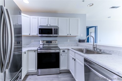 This inviting 3-bed, 2-bath main-level condo sits in The Ledges - photo 11