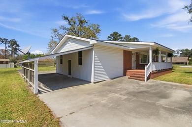 Situated on a rare full acre with no HOA, this cute brick home - photo 35