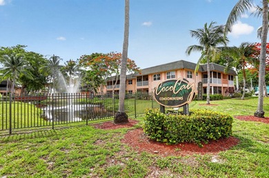 This condominium features an open kitchen, equipped with new - photo 1