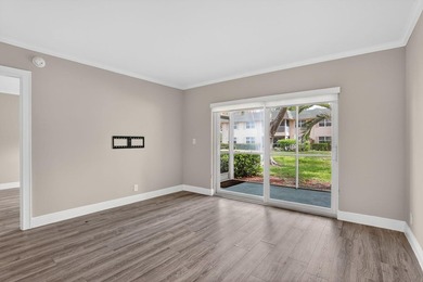 This condominium features an open kitchen, equipped with new - photo 10