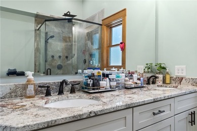 Experience exceptional lakefront living in this custom-built - photo 35