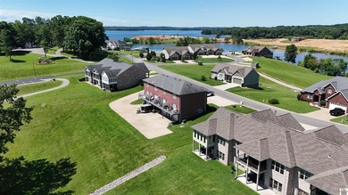 Nestled in the scenic waterfront community Moon Bay , this - photo 2
