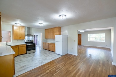 Relax on the porch & enjoy the feel of rural living right on the